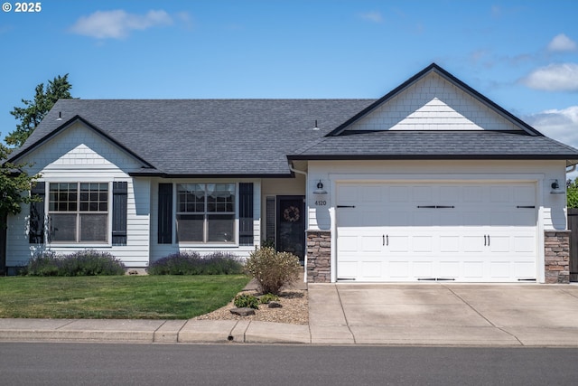 4120 Stellar Way, Springfield, OR 97478 - ranch-style home with a garage, concrete driveway, a front yard, stone siding, and a shingled roof