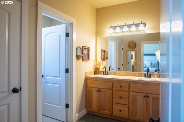 4120 Stellar Way, Springfield, OR 97478 - bathroom featuring double vanity and baseboards