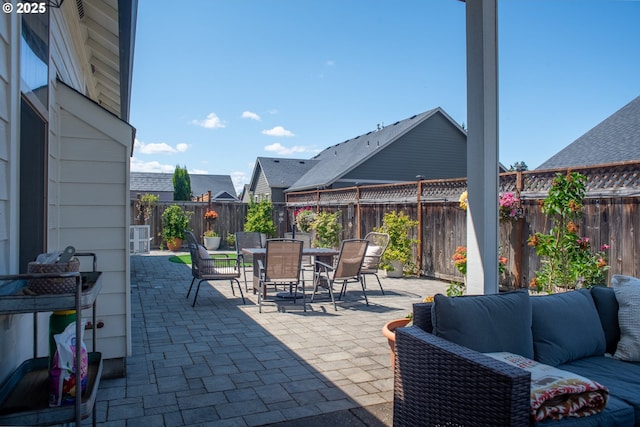 4120 Stellar Way, Springfield, OR 97478 - fenced backyard with an outdoor hangout area, a patio, and outdoor dining area