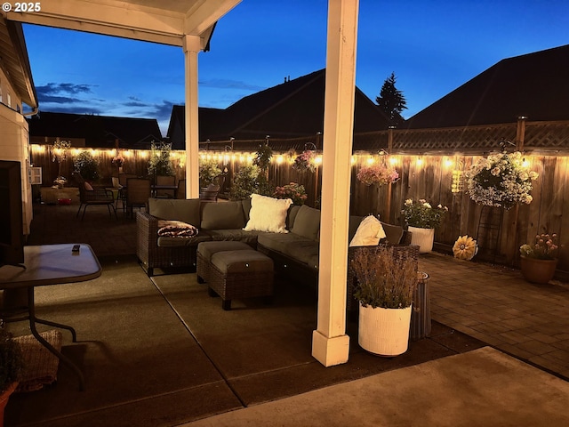 4120 Stellar Way, Springfield, OR 97478 - patio at night with an outdoor living space, a patio, and a fenced backyard
