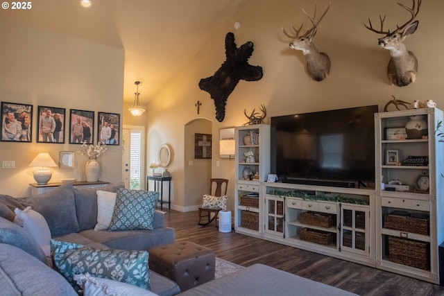 4120 Stellar Way, Springfield, OR 97478 - living room featuring wood finished floors, baseboards, arched walkways, and high vaulted ceiling