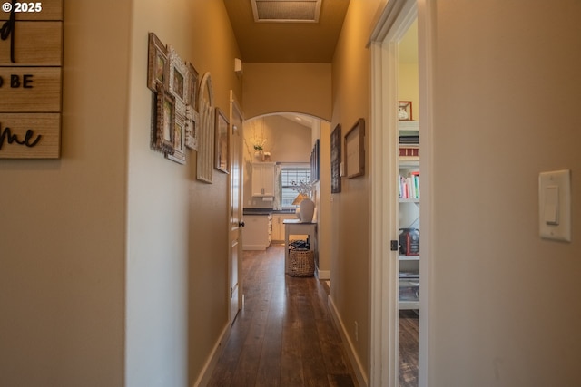 4120 Stellar Way, Springfield, OR 97478 - hallway with dark wood-type flooring, arched walkways, and baseboards