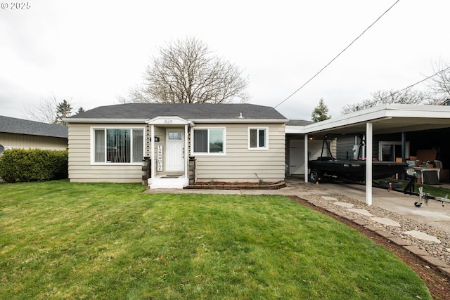 view of front of home featuring a carport and a front lawn