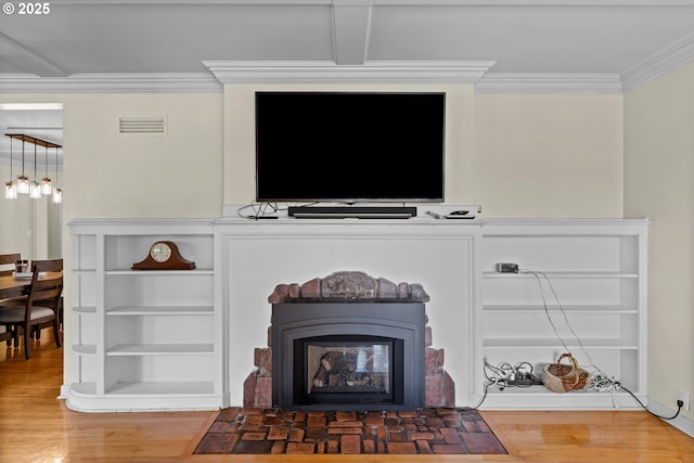 415 W Madrone St, Roseburg, OR 97470 - detailed view of wood finished floors, ornamental molding, and a fireplace with flush hearth