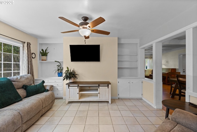 415 W Madrone St, Roseburg, OR 97470 - living area featuring a ceiling fan, built in shelves, and light tile patterned floors
