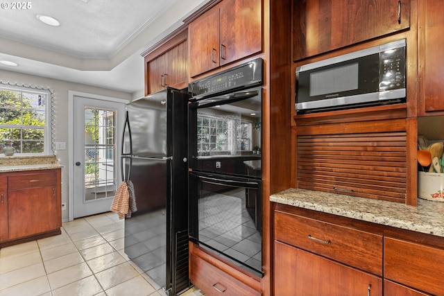 415 W Madrone St, Roseburg, OR 97470 - kitchen with black appliances, crown molding, a tray ceiling, light tile patterned floors, and light stone countertops