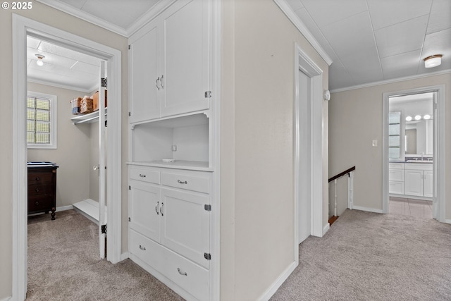 415 W Madrone St, Roseburg, OR 97470 - hallway with light colored carpet, ornamental molding, and an upstairs landing
