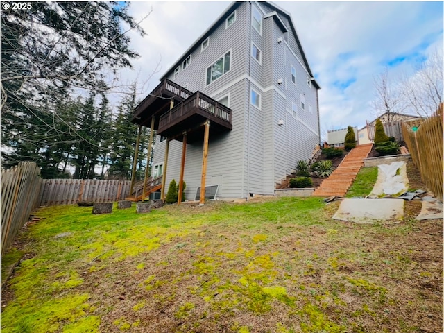 rear view of property with a yard