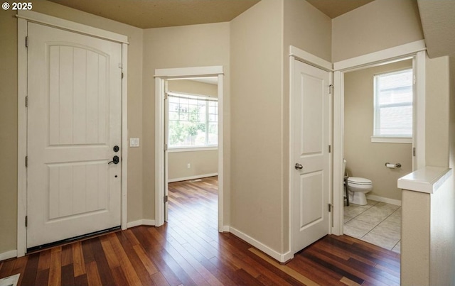 entryway with dark hardwood / wood-style floors