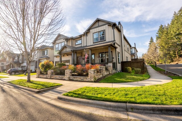 craftsman-style home featuring a front lawn and covered porch