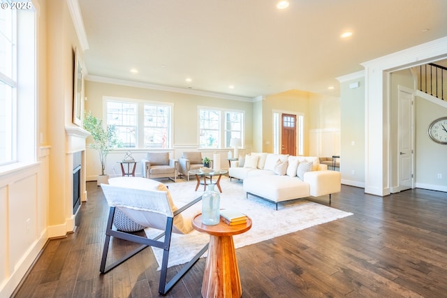 living area with baseboards, recessed lighting, a fireplace, dark wood-style floors, and crown molding