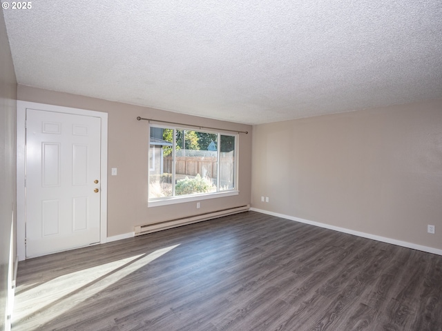 7450 N Portsmouth Ave, Portland, OR 97203 - unfurnished living room featuring a baseboard radiator, baseboards, a textured ceiling, and dark wood-style floors