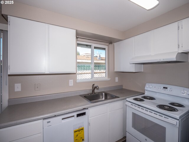 7450 N Portsmouth Ave, Portland, OR 97203 - kitchen featuring under cabinet range hood, light countertops, a sink, white appliances, and white cabinetry