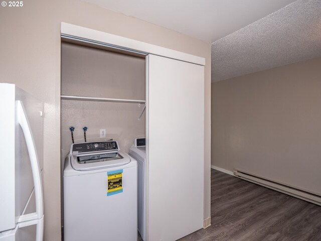 7450 N Portsmouth Ave, Portland, OR 97203 - laundry area with a baseboard radiator, wood finished floors, laundry area, and washer / clothes dryer