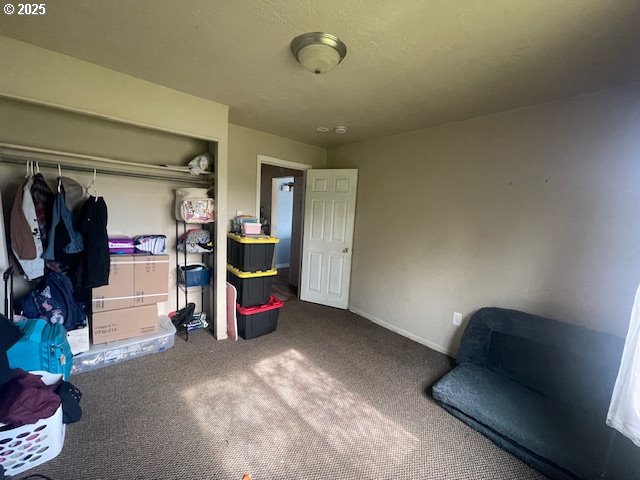 bedroom with carpet floors and a closet