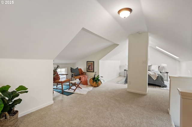 bonus room featuring lofted ceiling, carpet flooring, and baseboards
