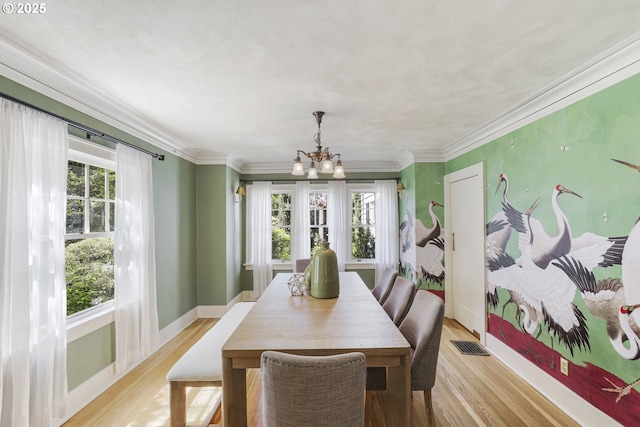 1805 SW Elizabeth St, Portland, OR 97201 - dining room featuring a chandelier, plenty of natural light, light wood finished floors, baseboards, and ornamental molding