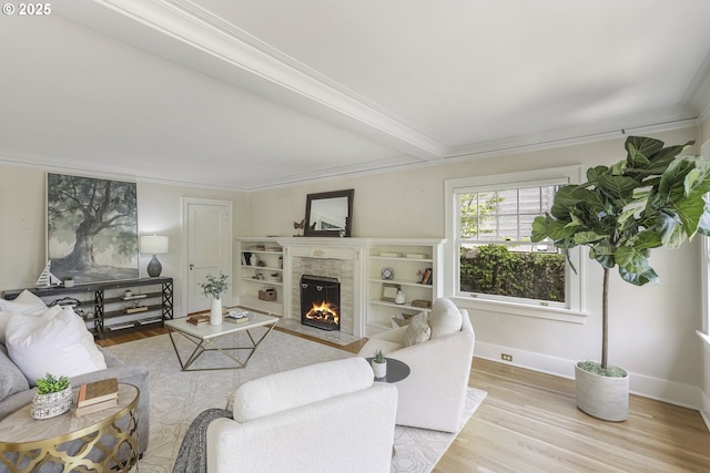 1805 SW Elizabeth St, Portland, OR 97201 - living room featuring a fireplace with flush hearth, wood finished floors, ornamental molding, and baseboards