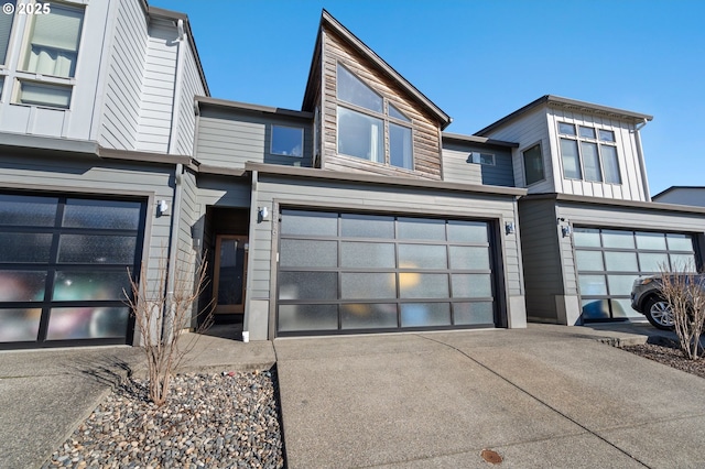 view of front of property featuring a garage and concrete driveway