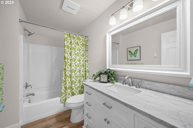 full bathroom featuring shower / tub combo, vanity, toilet, and wood finished floors