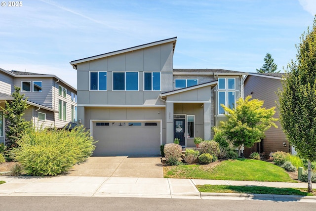 modern home with driveway, a garage, and board and batten siding