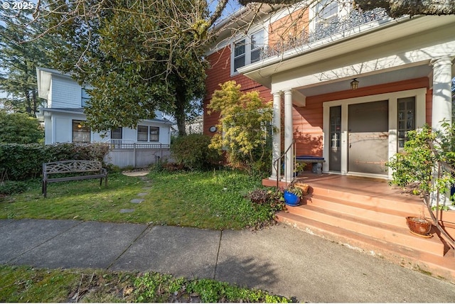 doorway to property featuring covered porch