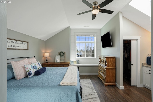 bedroom featuring baseboards, visible vents, dark wood-style floors, ceiling fan, and vaulted ceiling