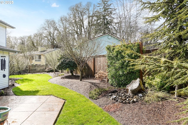 view of yard featuring a patio area and fence