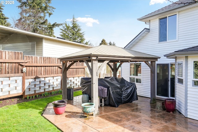 view of patio / terrace with fence and a gazebo