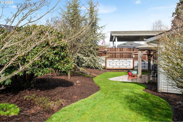 view of yard with a patio, a gazebo, and fence