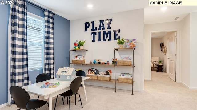 carpeted dining area featuring visible vents and baseboards