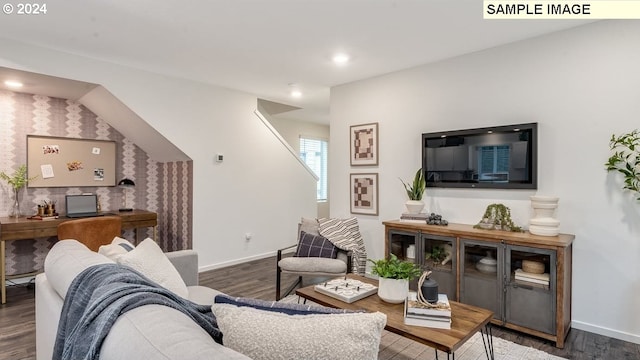 living area featuring baseboards, wood finished floors, and recessed lighting