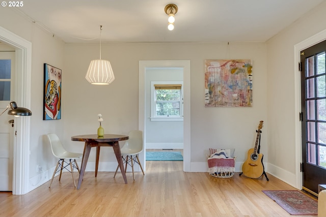 7154 N Greeley Ave, Portland, OR 97217 - dining space with light wood-style floors and baseboards