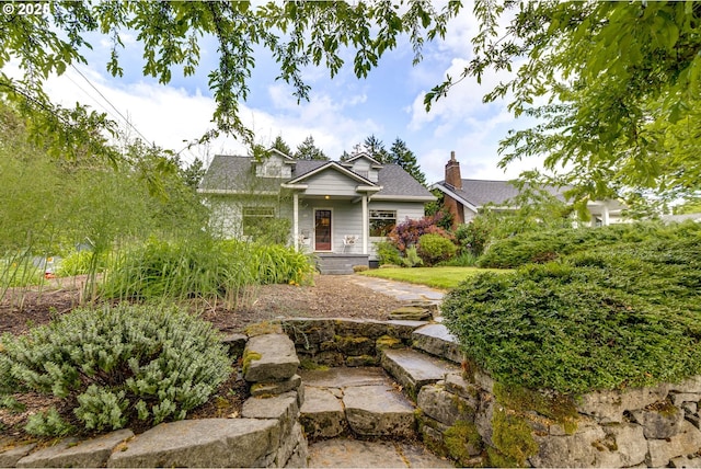 7154 N Greeley Ave, Portland, OR 97217 - view of front of house with a chimney and a shingled roof