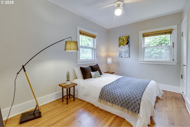 7154 N Greeley Ave, Portland, OR 97217 - bedroom with wood finished floors, ornamental molding, baseboards, and a ceiling fan