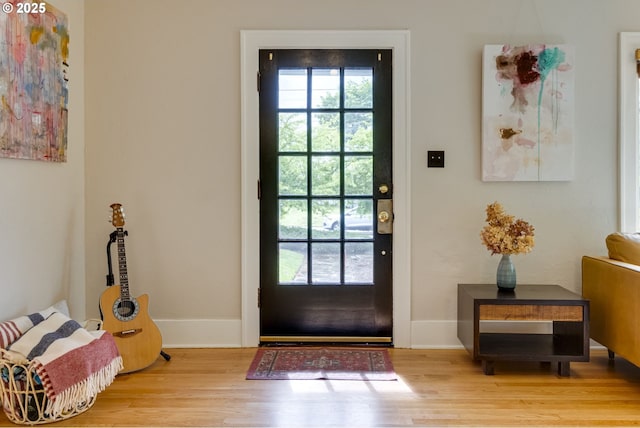 7154 N Greeley Ave, Portland, OR 97217 - doorway with plenty of natural light, wood finished floors, and baseboards
