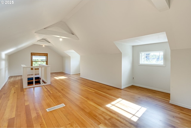 7154 N Greeley Ave, Portland, OR 97217 - additional living space featuring light wood-type flooring, vaulted ceiling, and baseboards