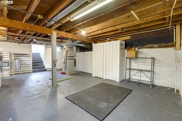 7154 N Greeley Ave, Portland, OR 97217 - unfinished basement featuring heating unit and stairway