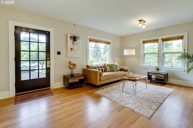 7154 N Greeley Ave, Portland, OR 97217 - living area featuring plenty of natural light, light wood finished floors, and baseboards