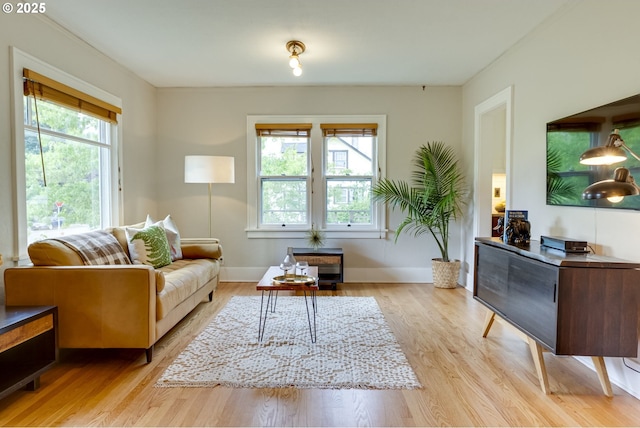 7154 N Greeley Ave, Portland, OR 97217 - living area with light wood-style flooring and baseboards