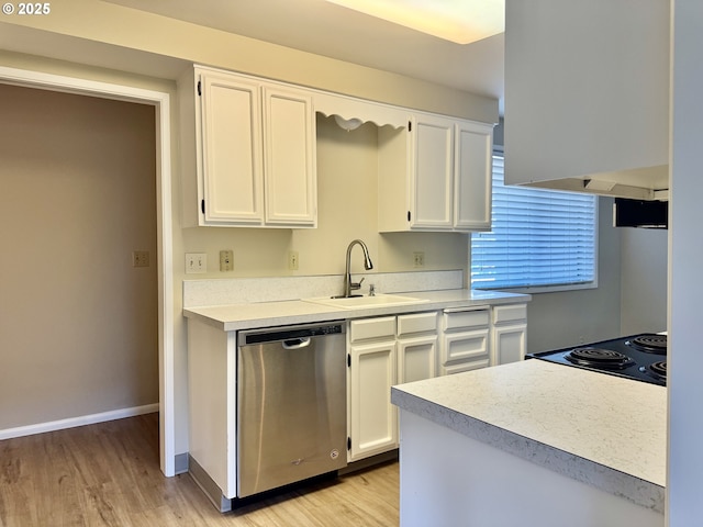 kitchen with light wood-type flooring, dishwasher, a sink, and white cabinetry