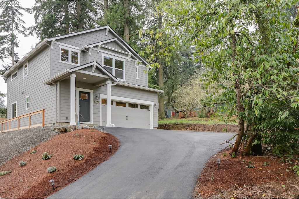 craftsman inspired home with a garage