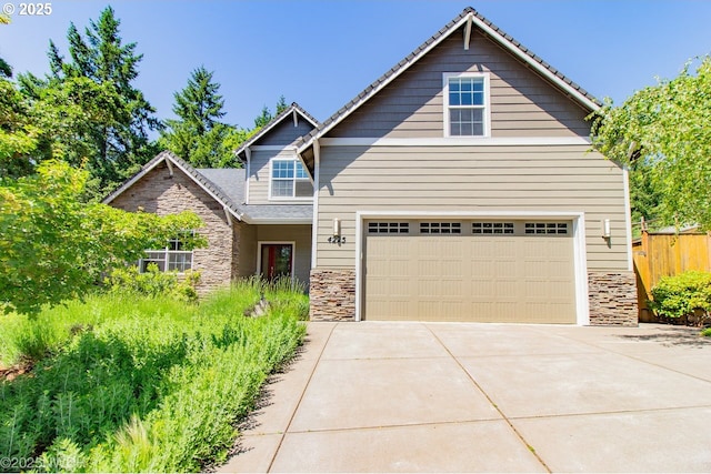 4225 Wendell Ln, Eugene, OR 97405 - craftsman inspired home featuring stone siding, an attached garage, and driveway