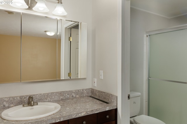 full bath with toilet, an enclosed shower, and vanity