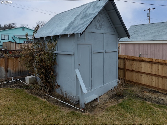 view of shed with fence