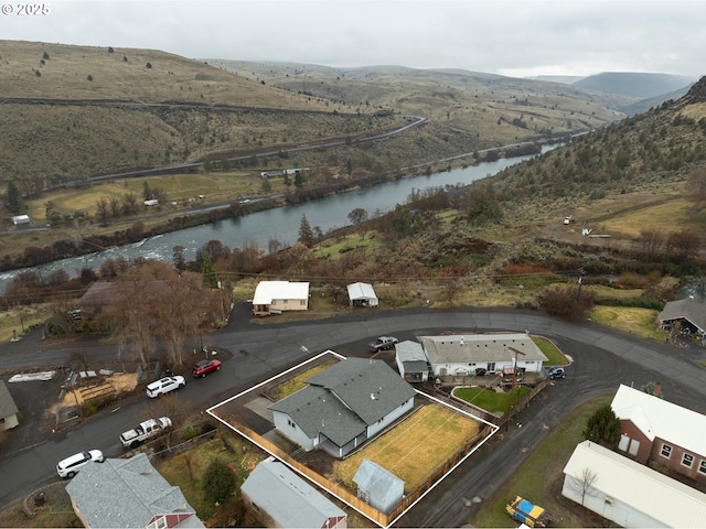 bird's eye view with a residential view and a water and mountain view