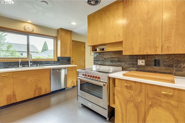kitchen with decorative backsplash, light countertops, finished concrete floors, a sink, and stainless steel appliances