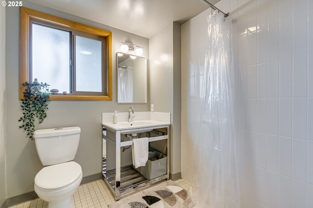bathroom with baseboards, tile patterned floors, toilet, and curtained shower