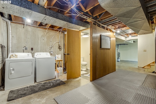 unfinished basement with washer and clothes dryer