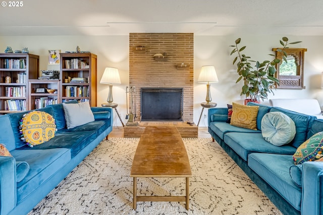 living room featuring wood finished floors and a fireplace